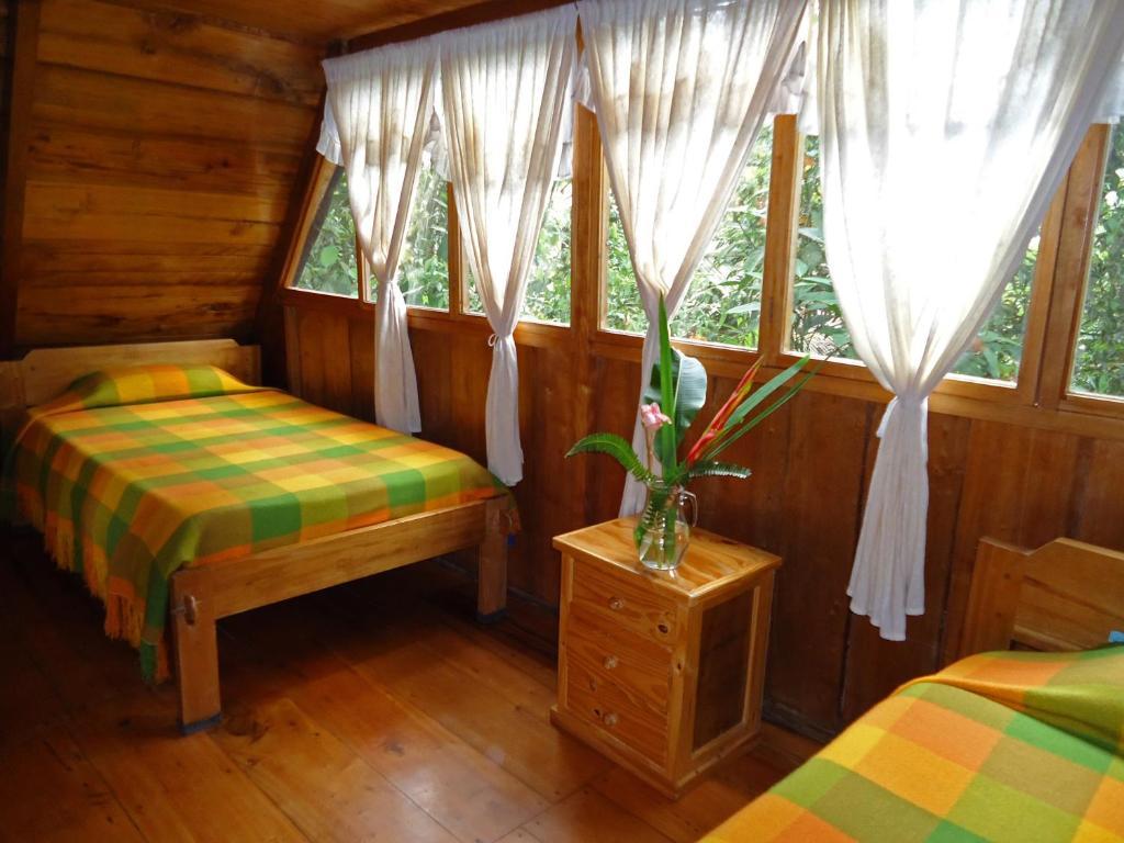 Cabañas Armonía y Jardín de Orquídeas Mindo Habitación foto